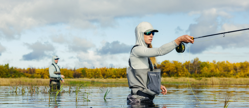 Man and woman fishing in Alaska